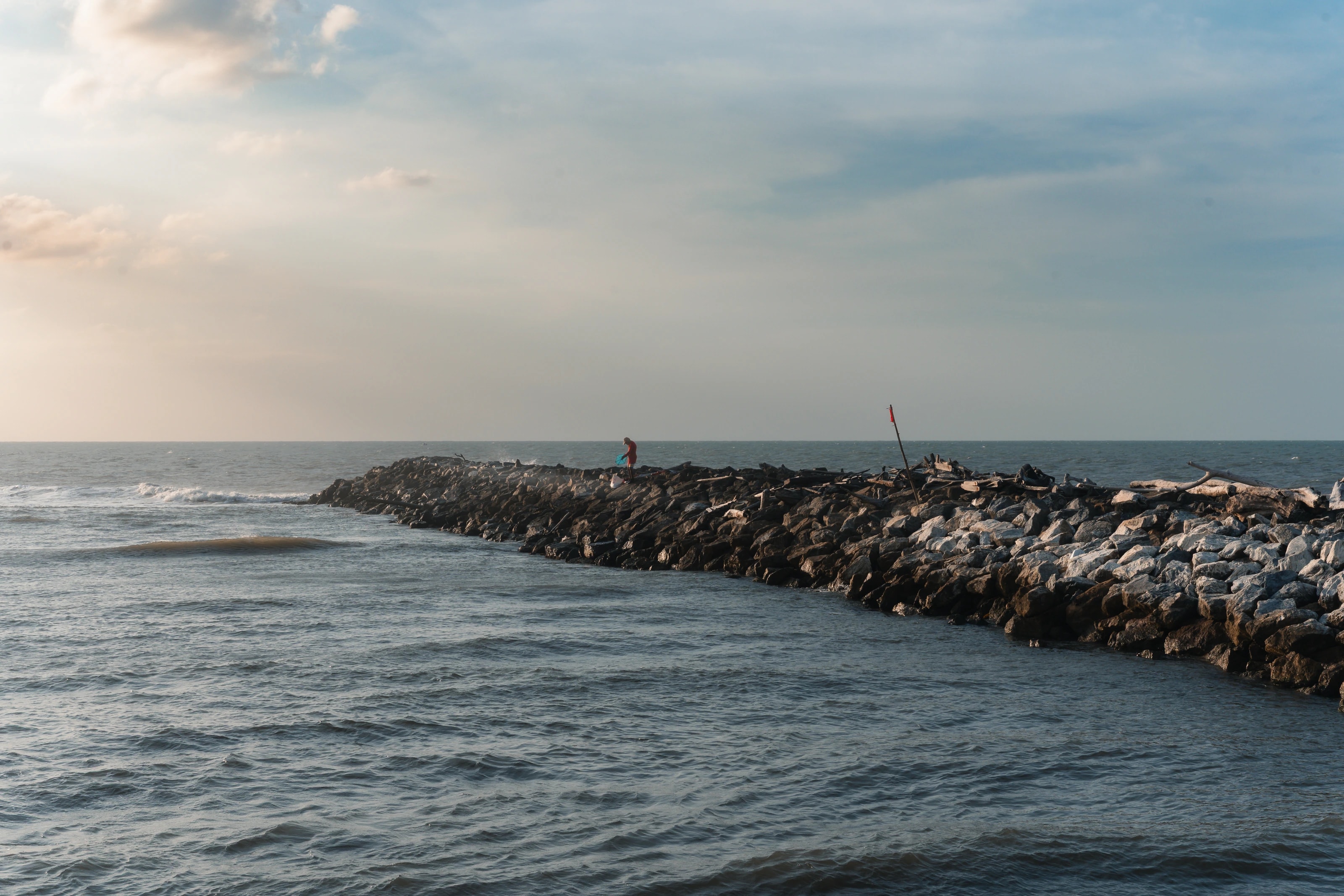Waves beside a stone breakwater